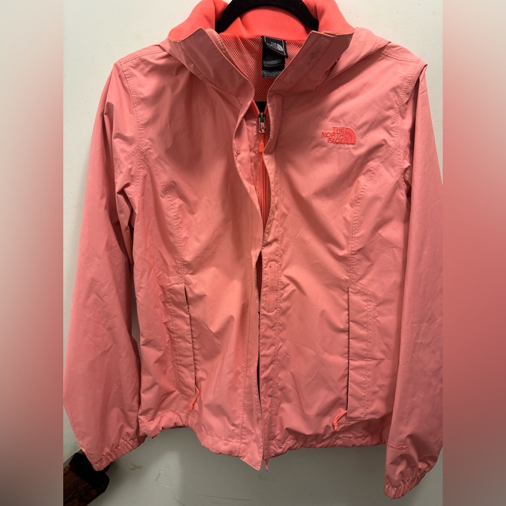 Bright pink North Face rain jacket